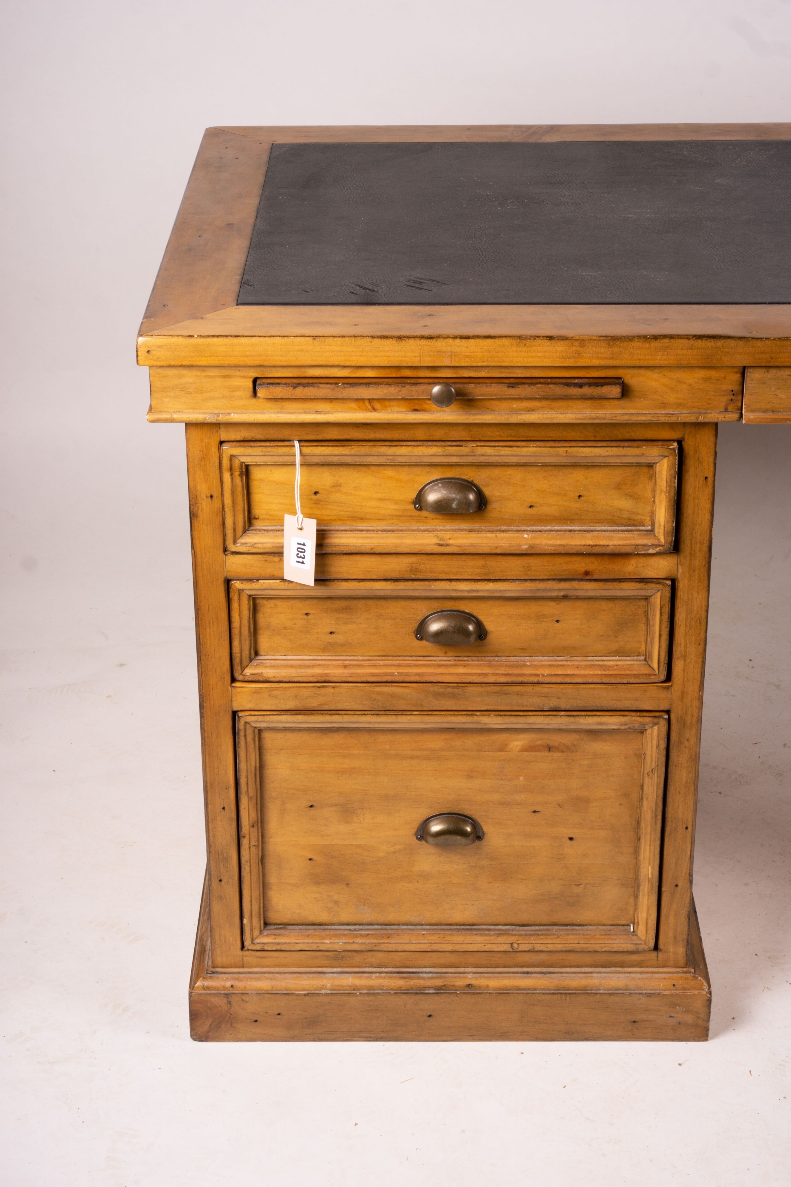 A reproduction pine kneehole desk, width 174cm, depth 79cm, height 86cm together with a matching pine three drawer filing cabinet